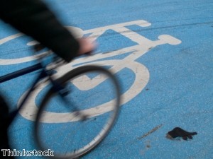 Cyclist knocked over by sprinting buck