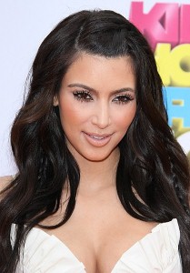 Kim Kardashian frolics in bikini on beach holiday