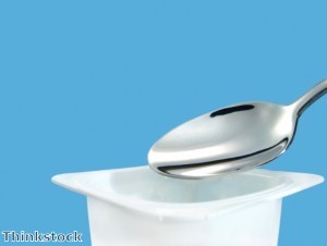 Magnetic Man balances 50 spoons on chest