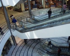 Man throws money off shopping centre balcony to win back wife