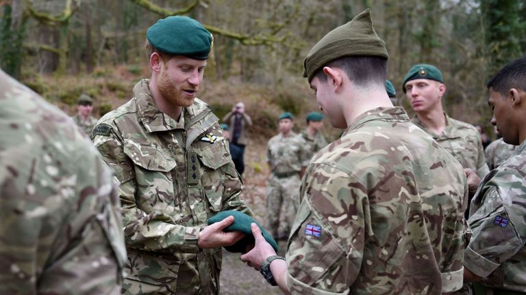 Prince Harry rewards Royal Marines with Green Berets as training ends